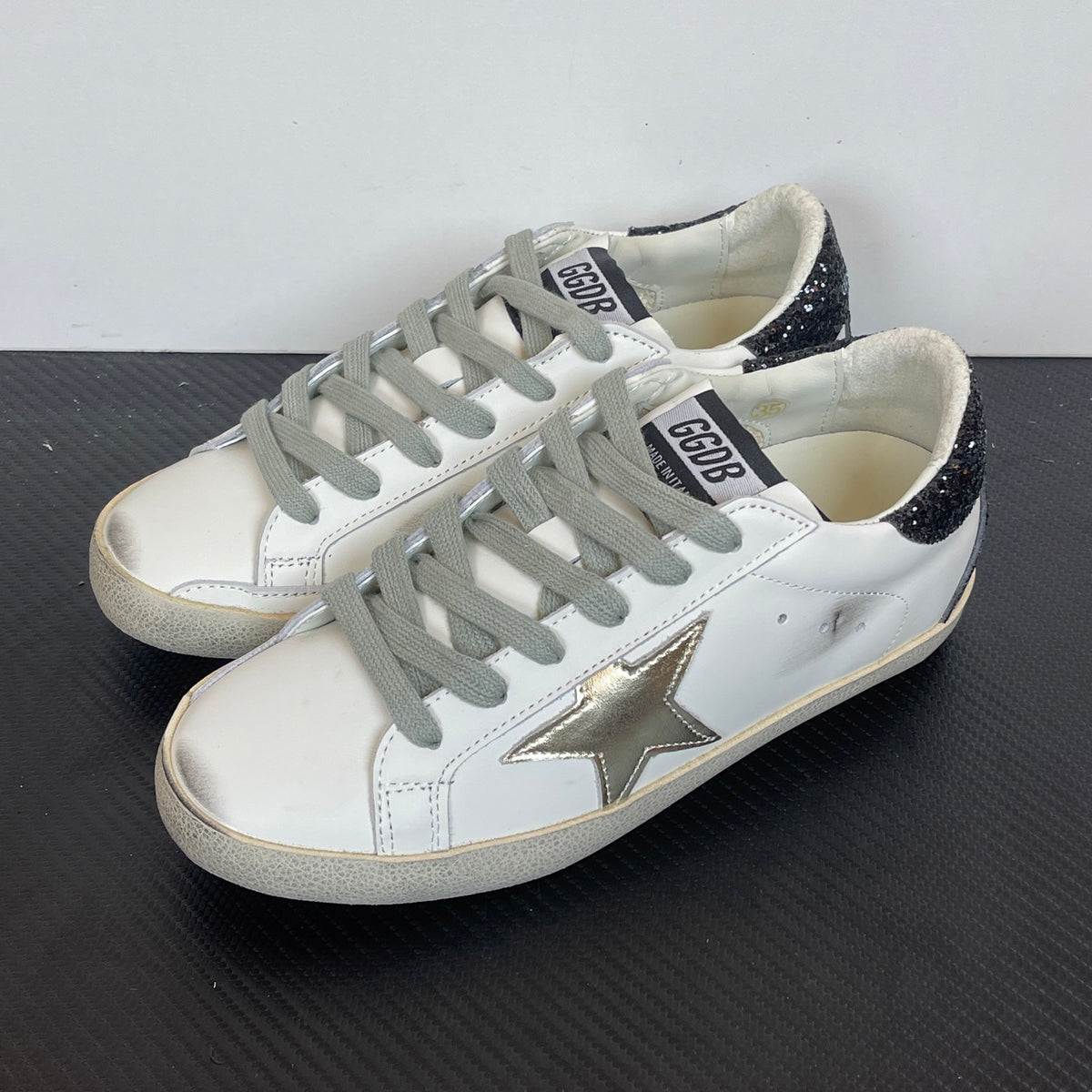 Women's Golden Goose Super-Star Golden Star and black glitter heels tab