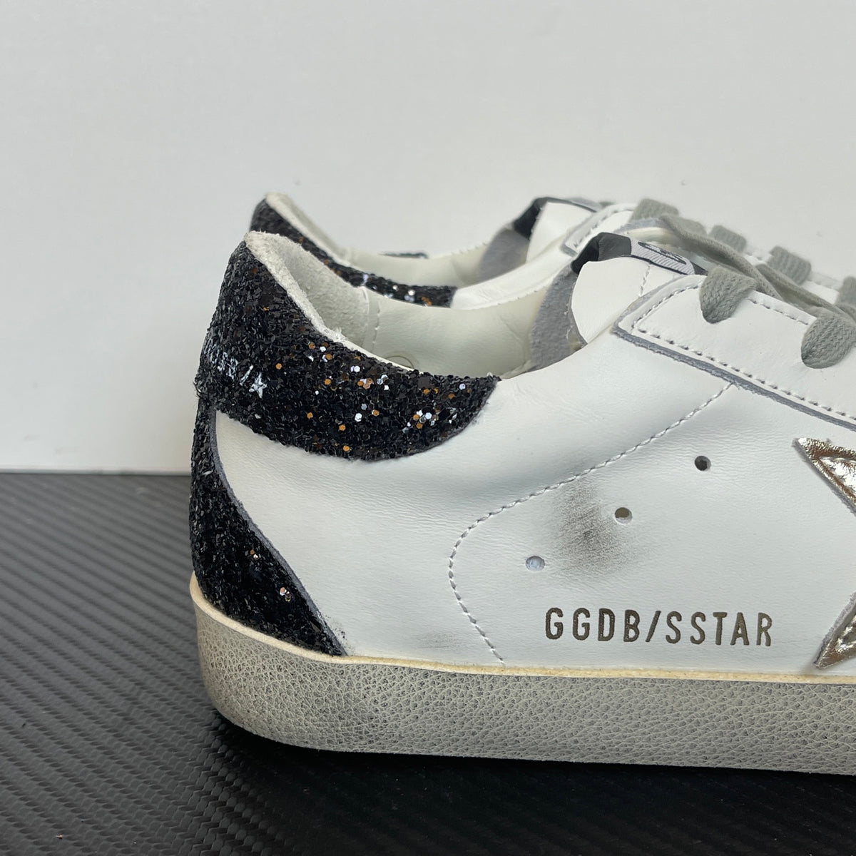 Women's Golden Goose Super-Star Golden Star and black glitter heels tab